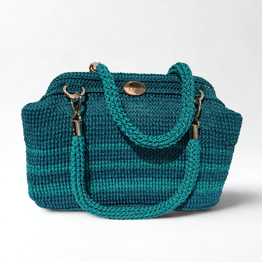 A teal and turquoise striped crocheted handbag with braided rope handles and gold-tone hardware, photographed on a clean white background.