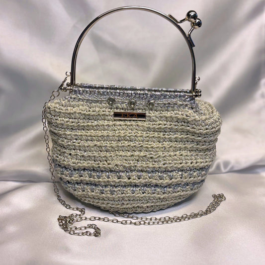 Crochet bag with crystals over a bright background